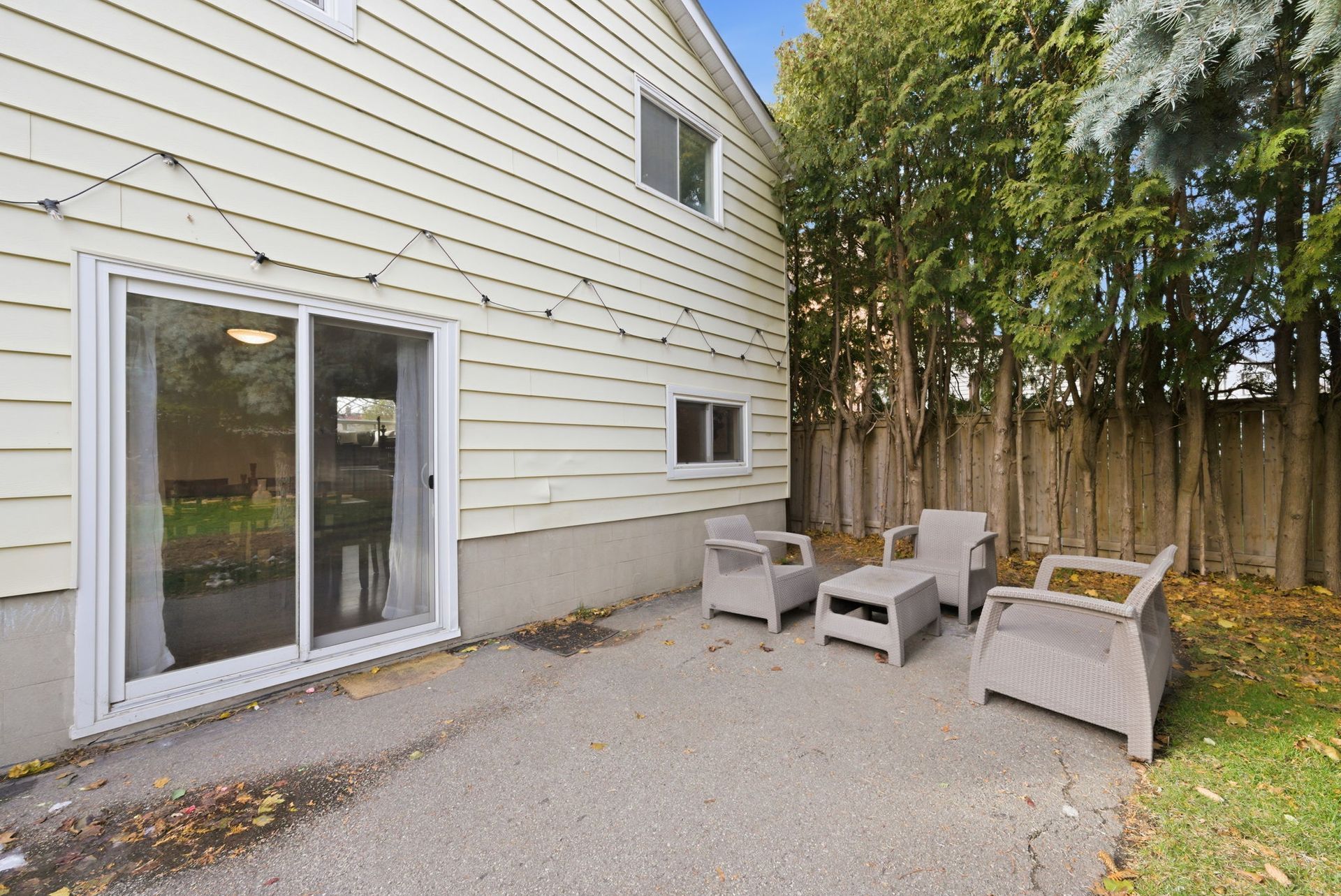 Fenced backyard with room for BBQ and play, listed by Laura  Cooper  Realtor