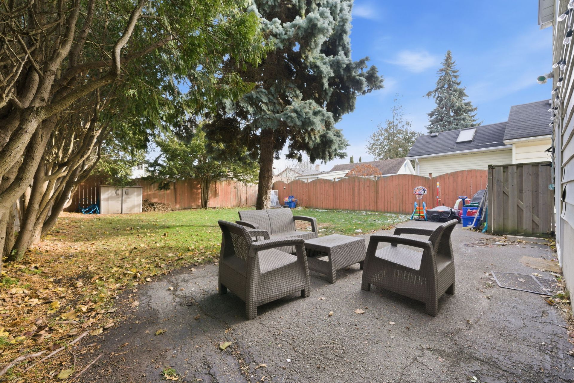 Fenced backyard with room for BBQ and play, listed  by Laura  Cooper  Realtor