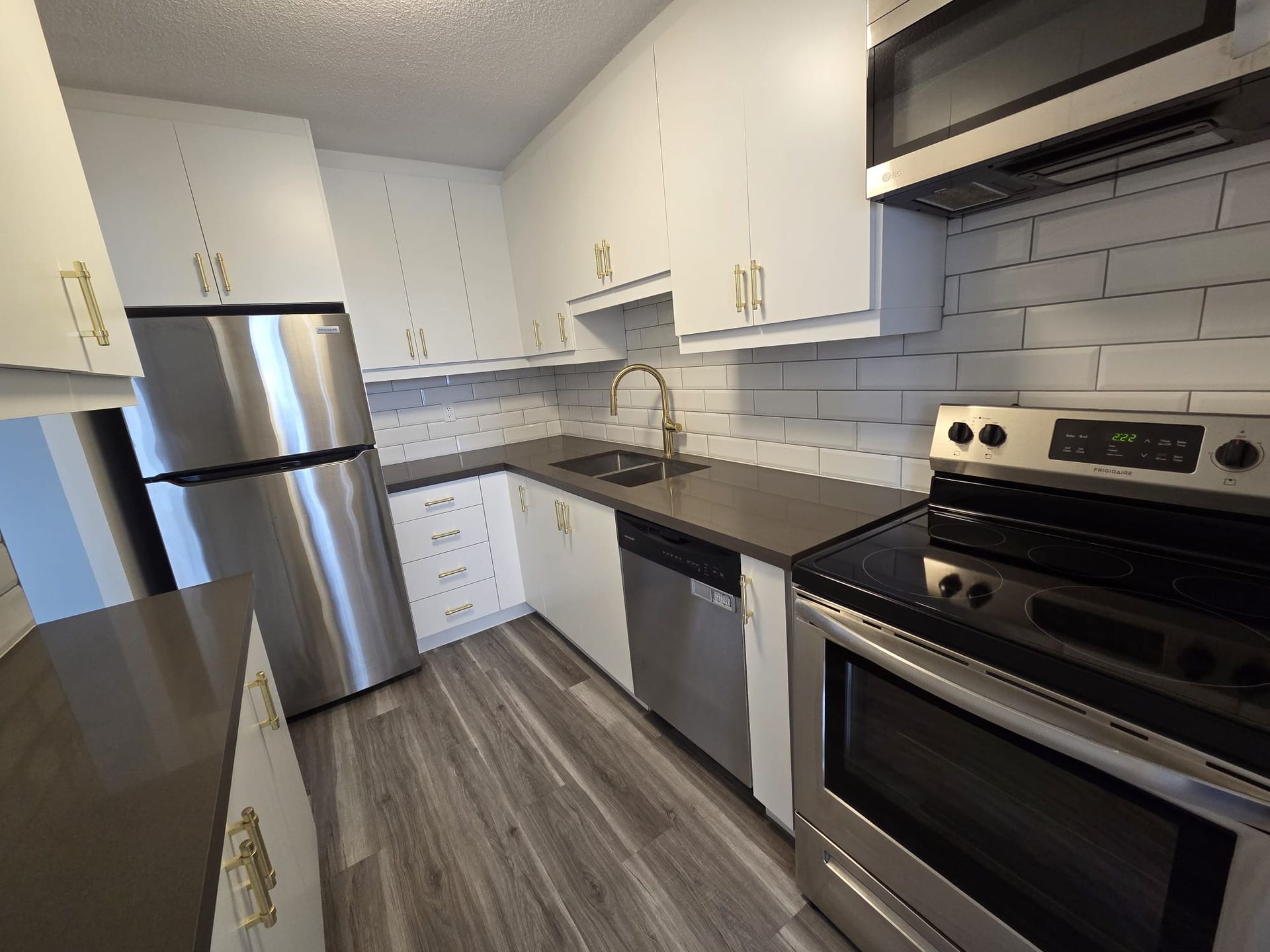 Kitchen detail showing modern backsplash and finishes, listed by Laura Cooper Realtor