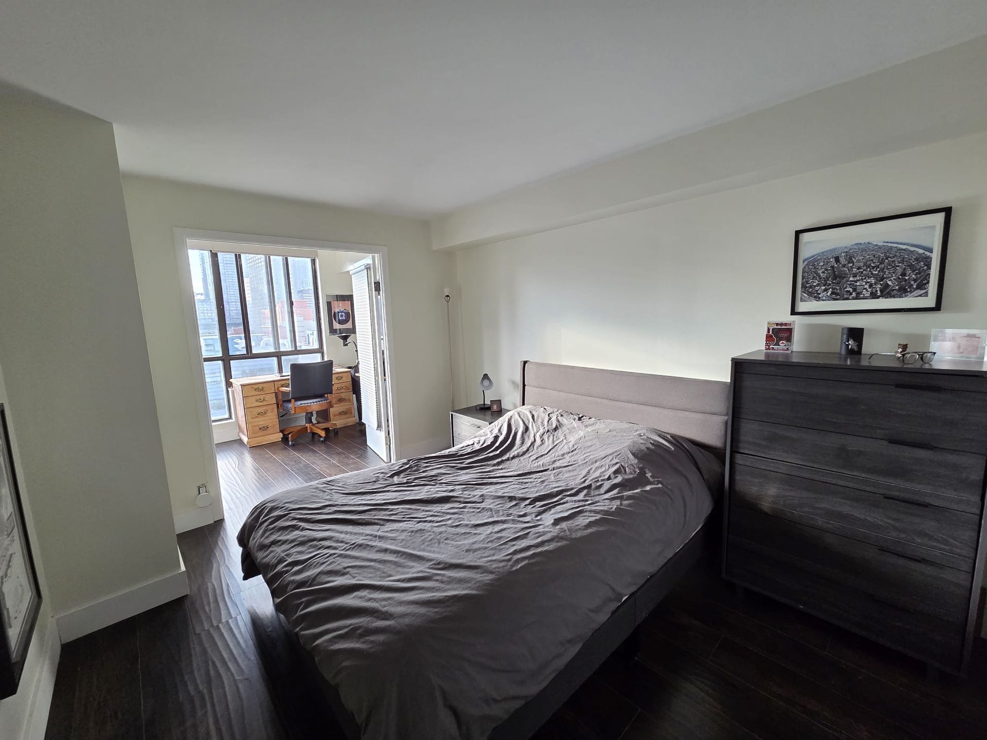 Primary bedroom with closet and large window light, 1111 condo by Laura Cooper Realtor