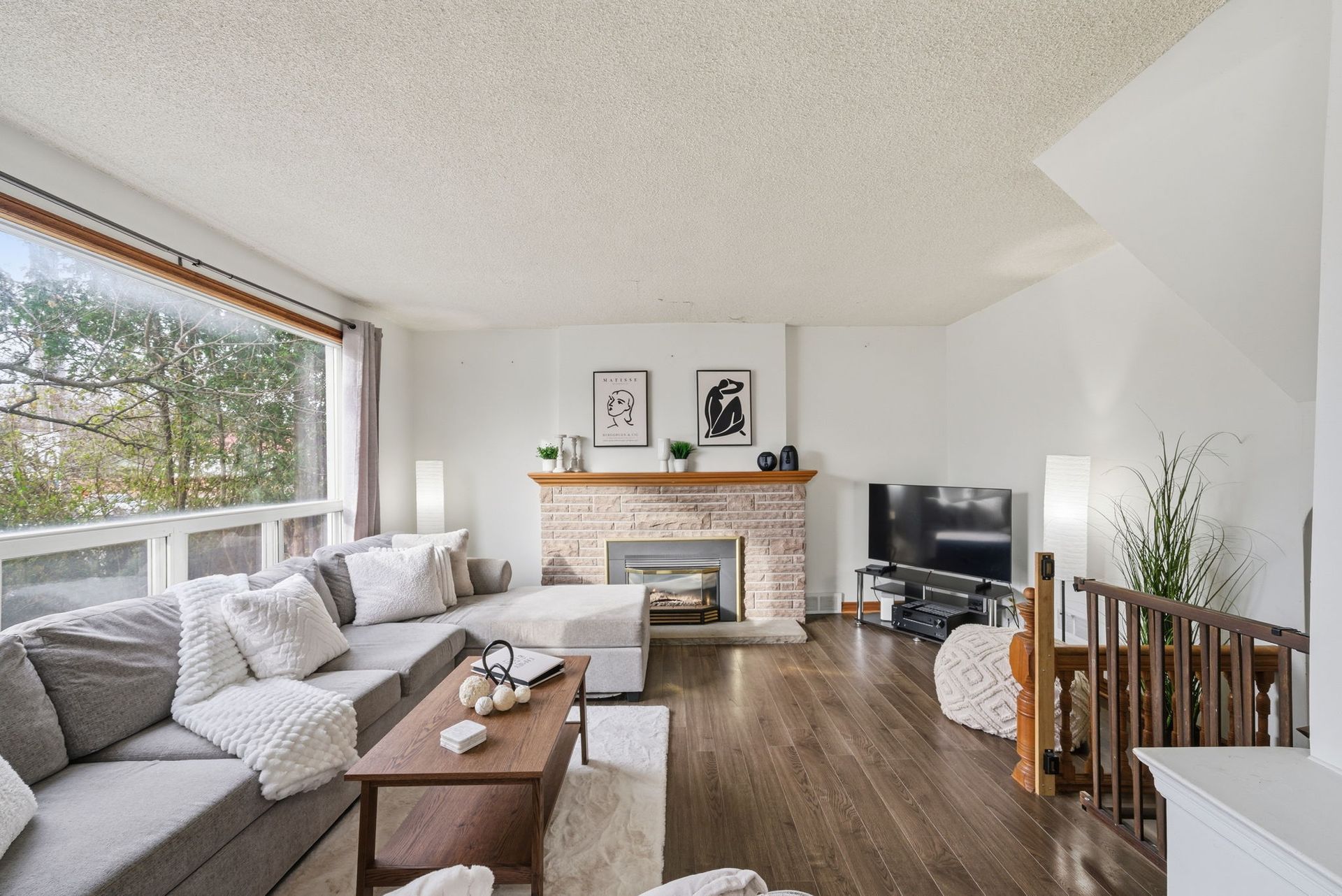 Bright living room with large windows and natural light, Oshawa property by Laura Cooper Realtor