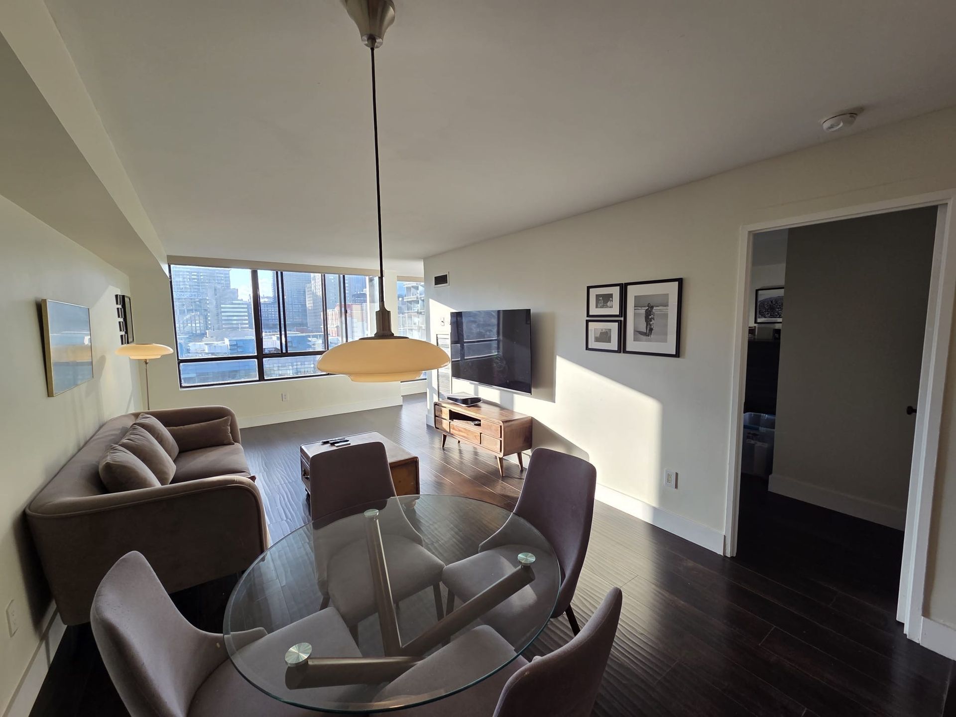 Dining area with table and chairs in furnished downtown condo by Laura Cooper Realtor