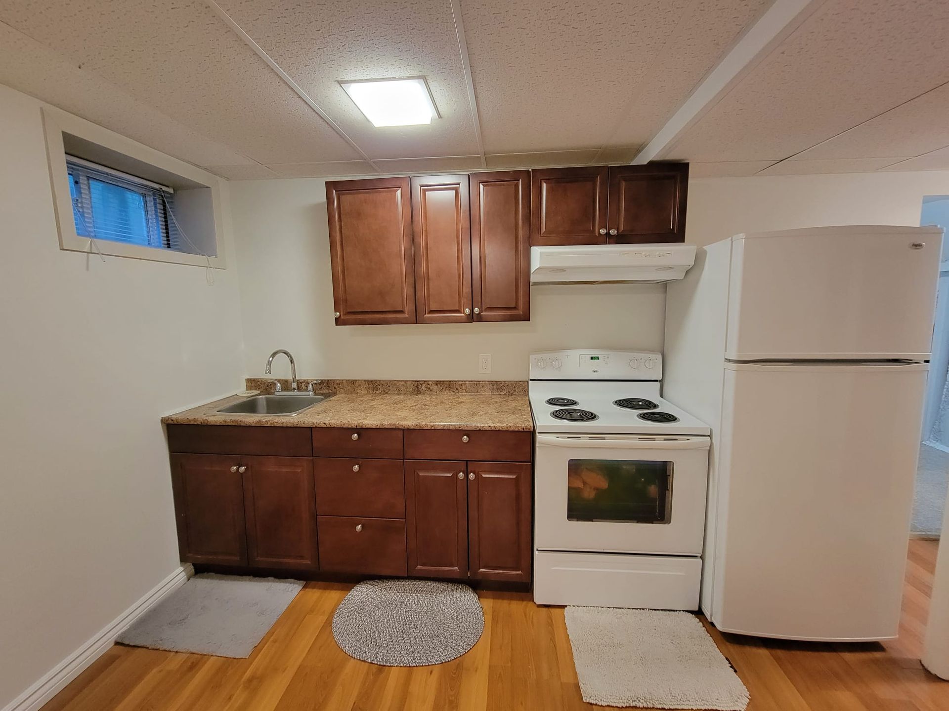 Kitchen detail showing cabinetry and appliances, Laura Cooper Realtor Toronto listing