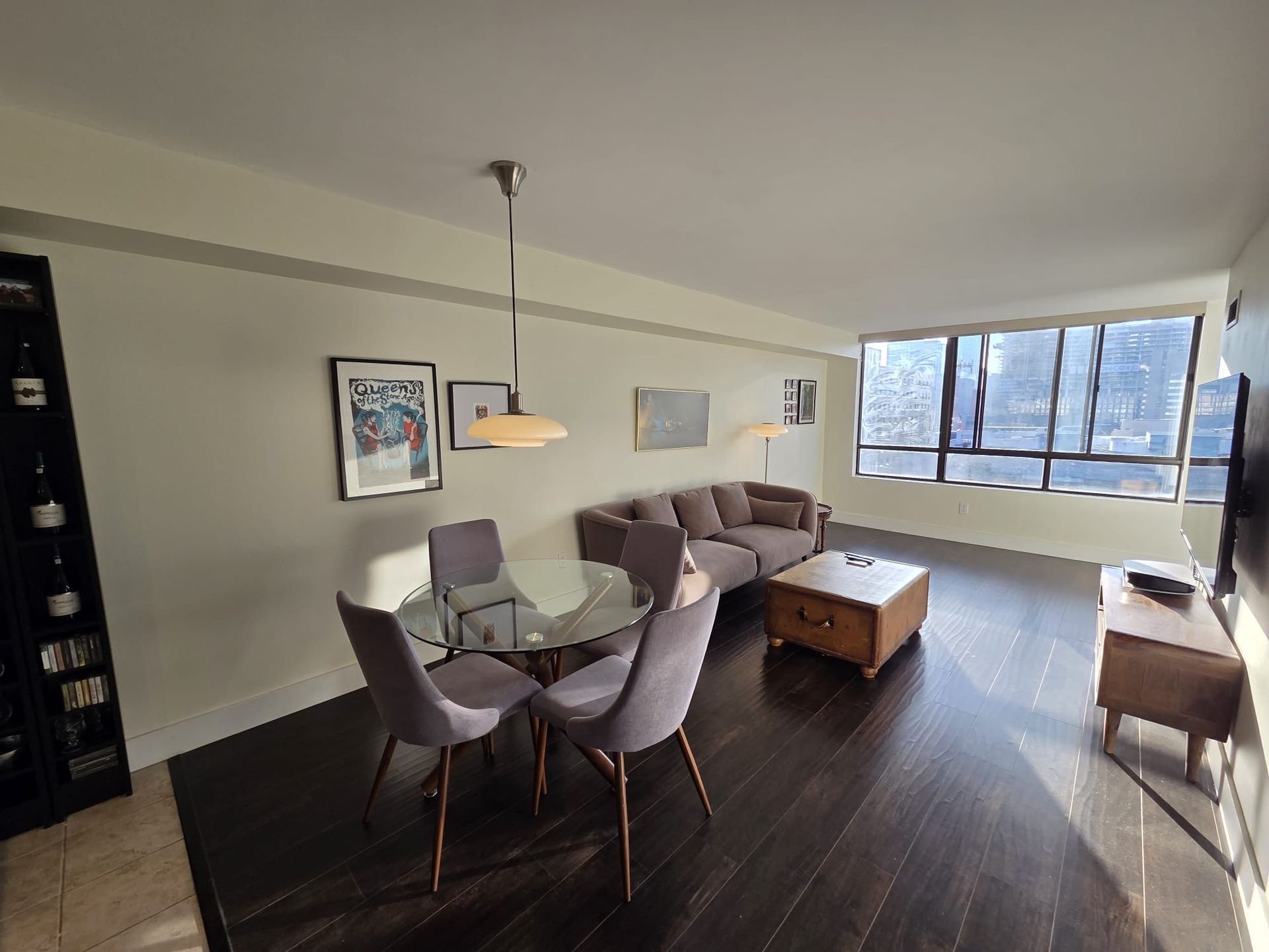 Living and dining area with large window and vinyl floors, Laura Cooper Realtor Toronto listing