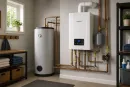 Modern home utility room with a water heater, boiler, exposed copper pipes, and a small window.