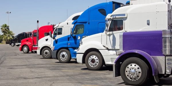 Row Of Trailer Trucks — Chicago, IL — Metropolitan Insurance Service Consultants, Inc Row Of Trailer Trucks — Chicago, IL — Metropolitan Insurance Service Consultants, Inc