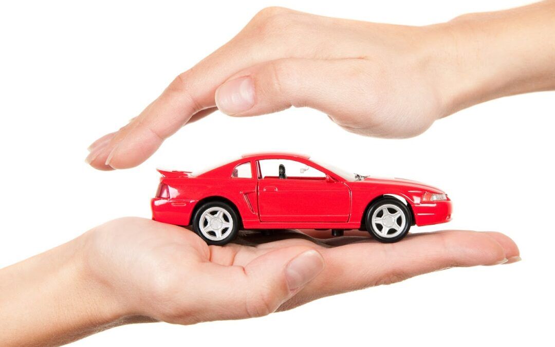 Holding Car Model — Chicago, IL — Metropolitan Insurance Service Consultants, Inc Holding Car Model — Chicago, IL — Metropolitan Insurance Service Consultants, Inc