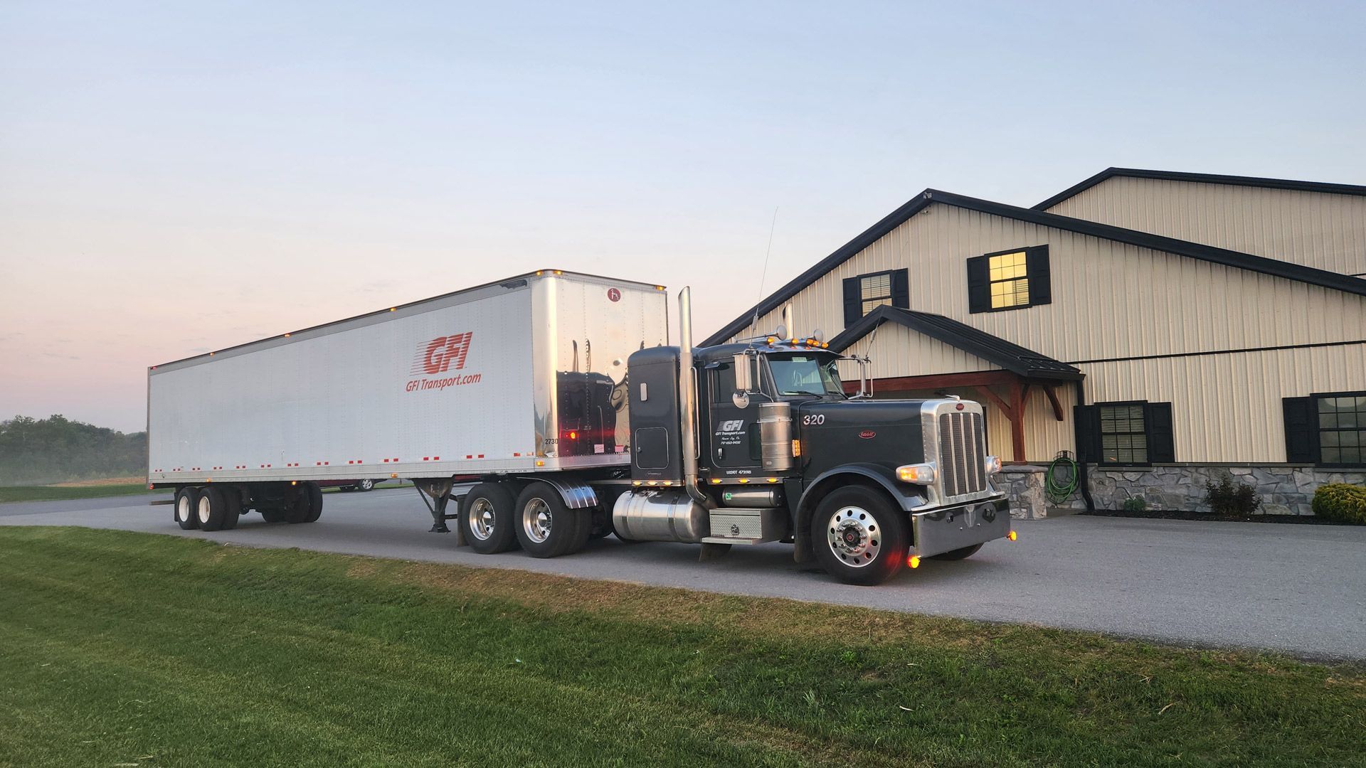 A GFI Transport semi truck is parked in a parking lot ready for corn shipping.