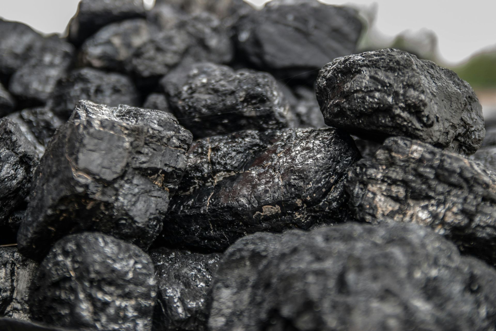 Close-up of a pile of black coal rocks outdoors