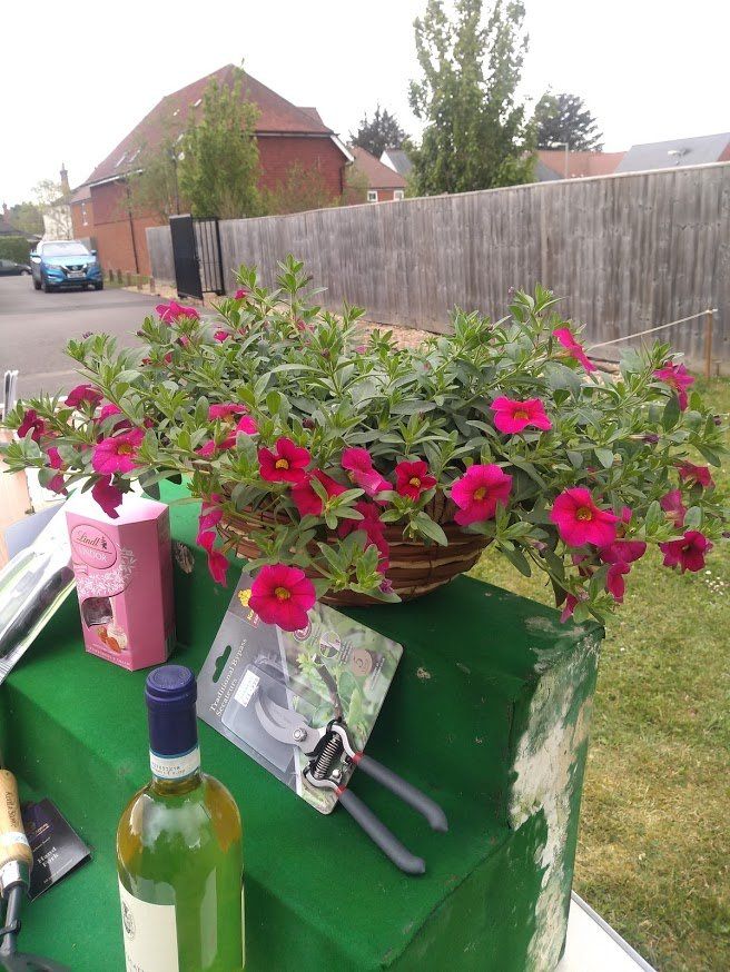 Raffle prizes close up showing hanging basket