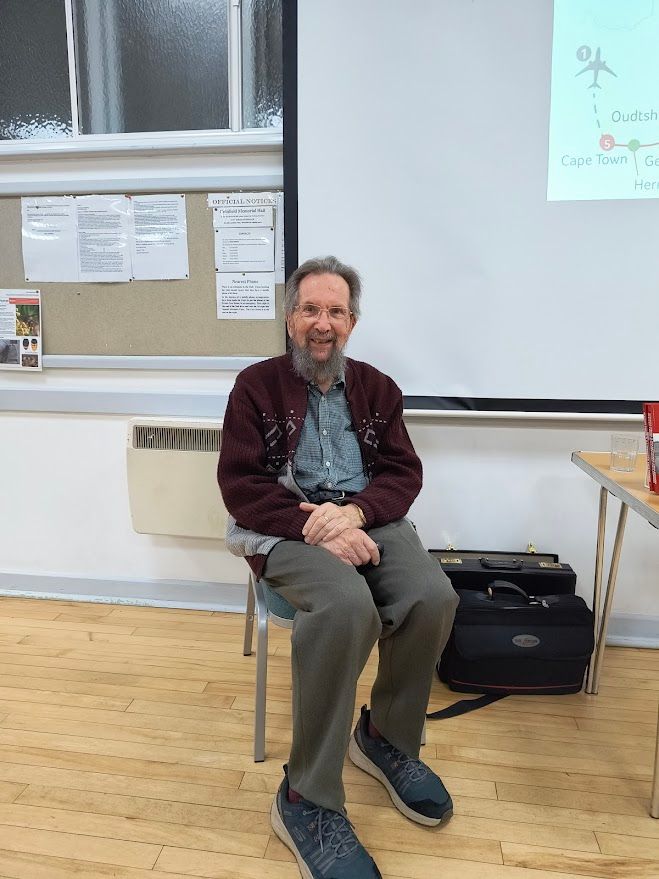 speaker Mark Porter enjoys a joke with Club members