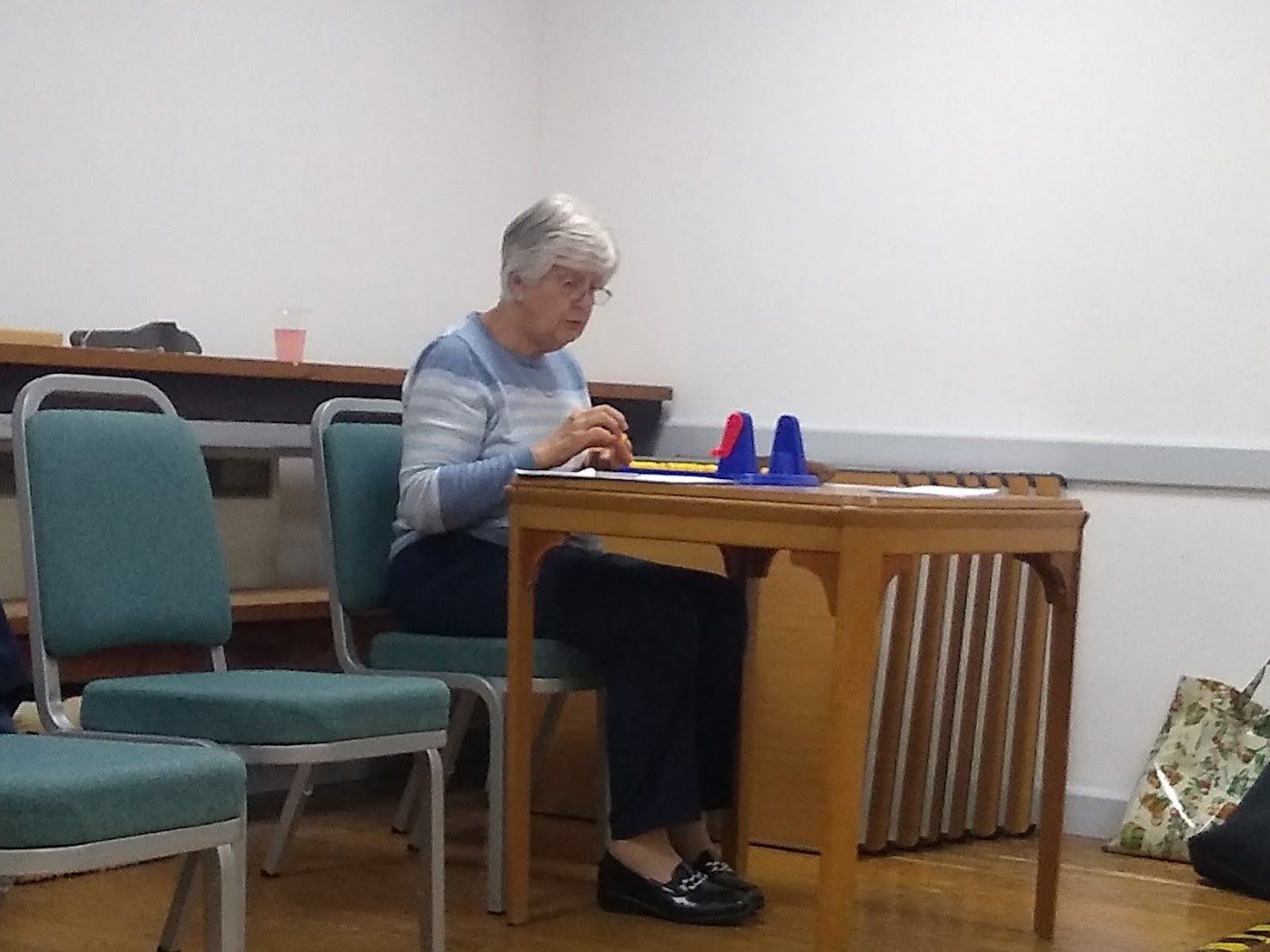 Photo of Jen Glover calling the numbers for bingo