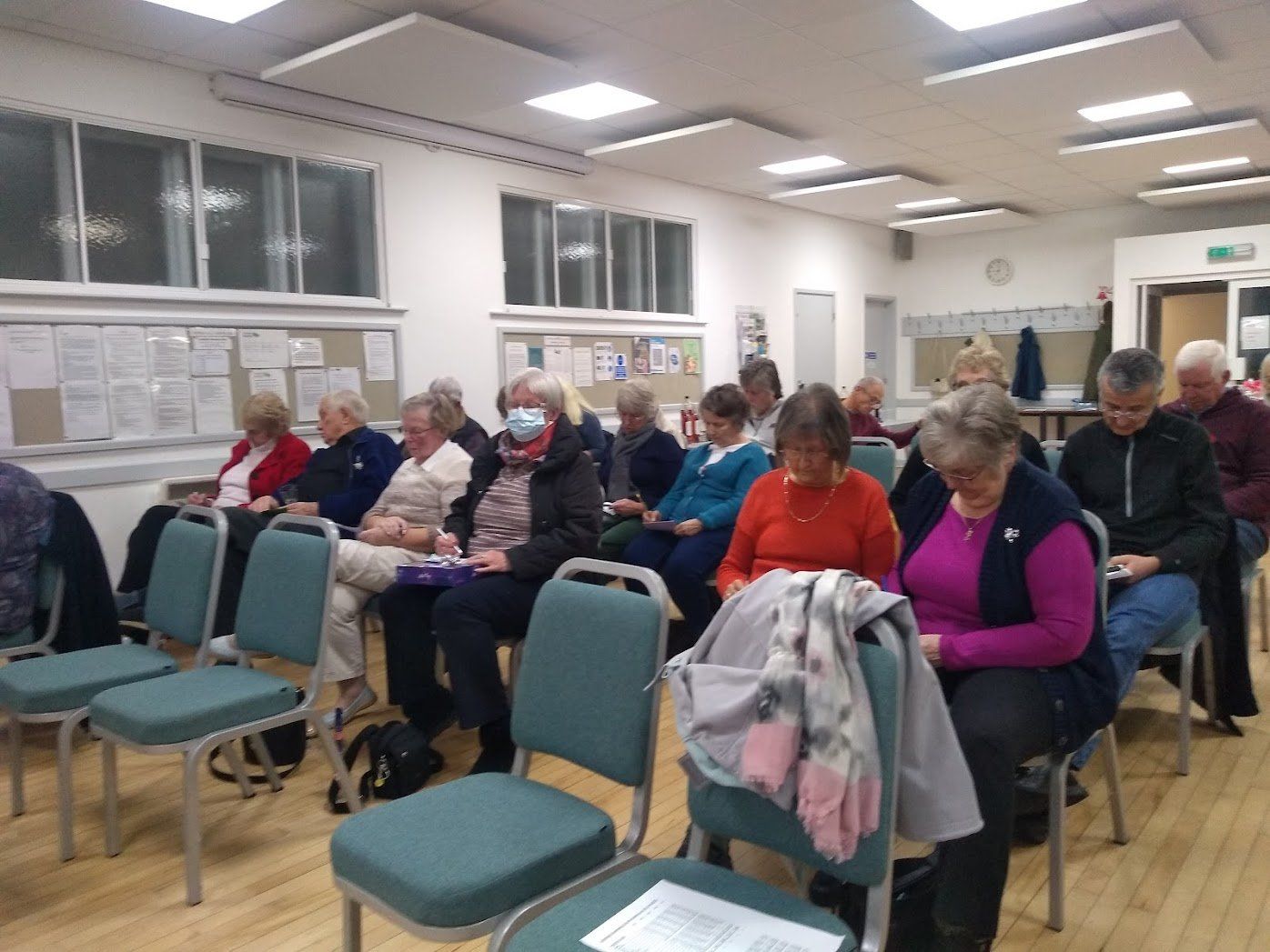 Photo of Members concentrating on their bingo cards