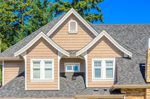 the roof of the house with nice window 
