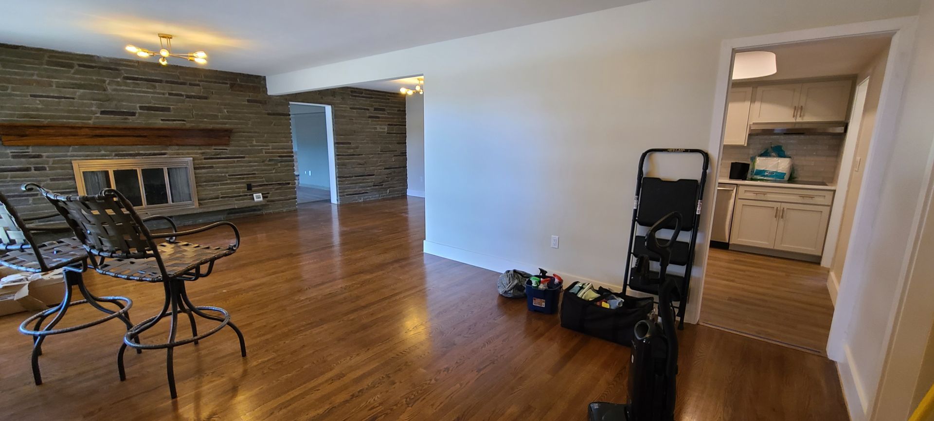 There is a table and chairs in the living room.