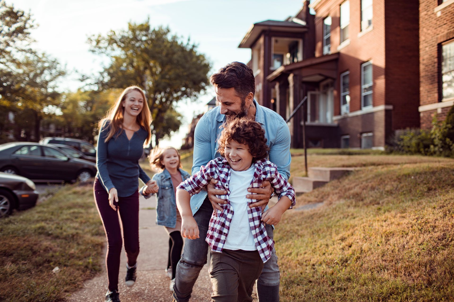 Family walking on a sidewalk