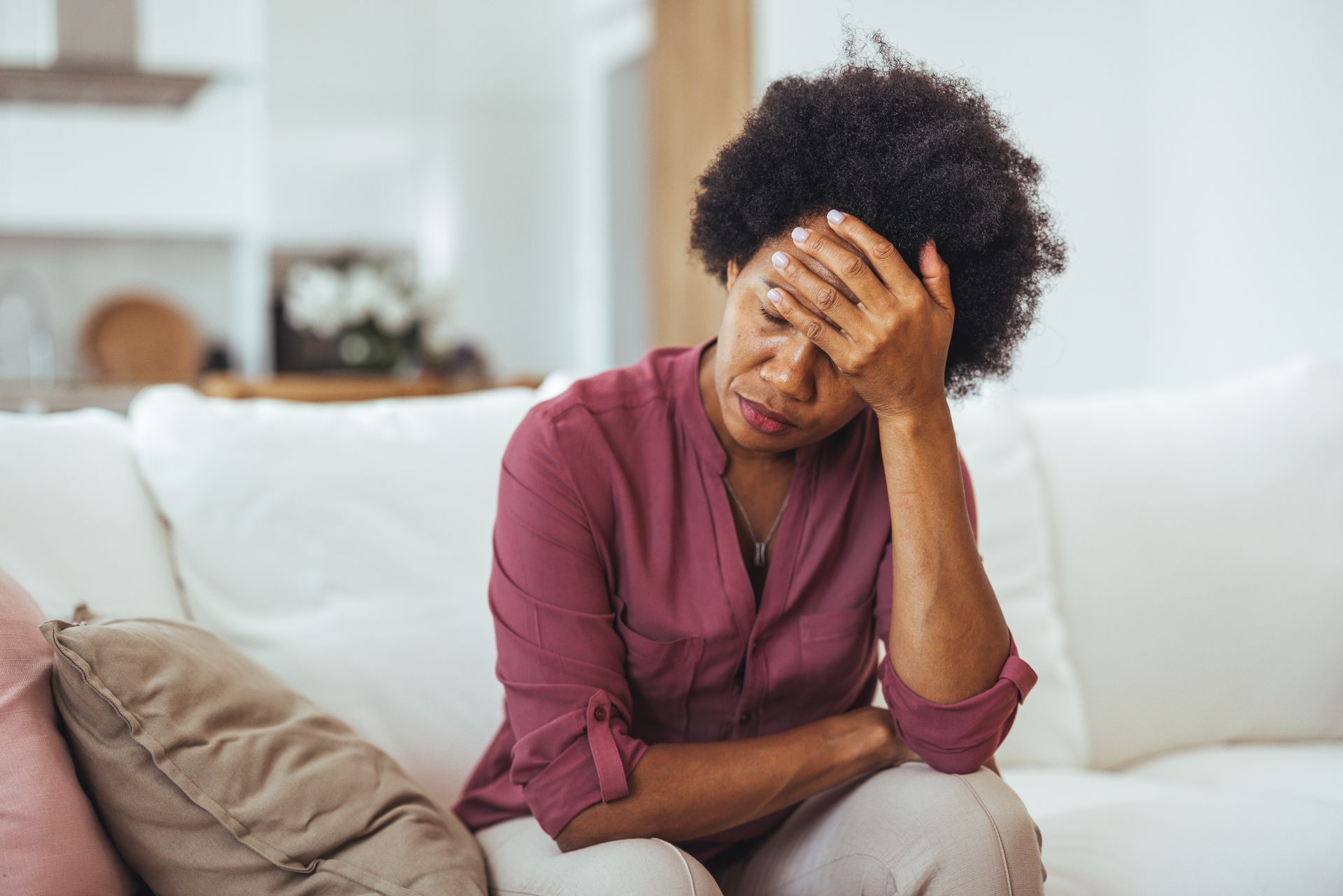 Woman appearing stressed