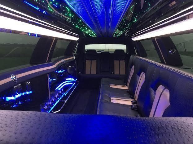 Luxury limo with sound system and bar features