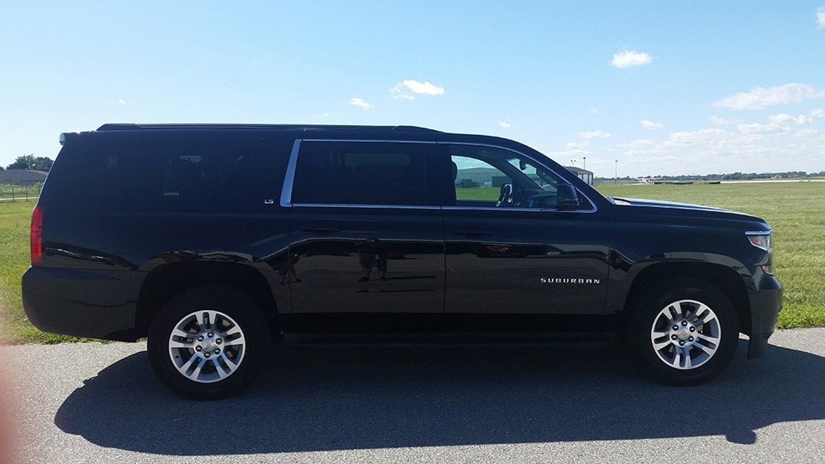 Chevy Suburban parked and ready for client pickup