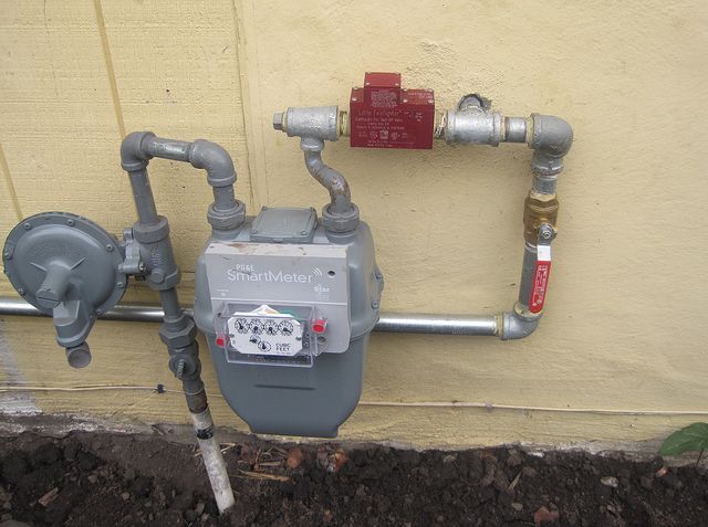 Earthquake Gas Shut Off Valve Gas meter against a wall