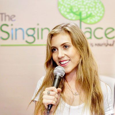 Blonde Girl Holding a Microphone
