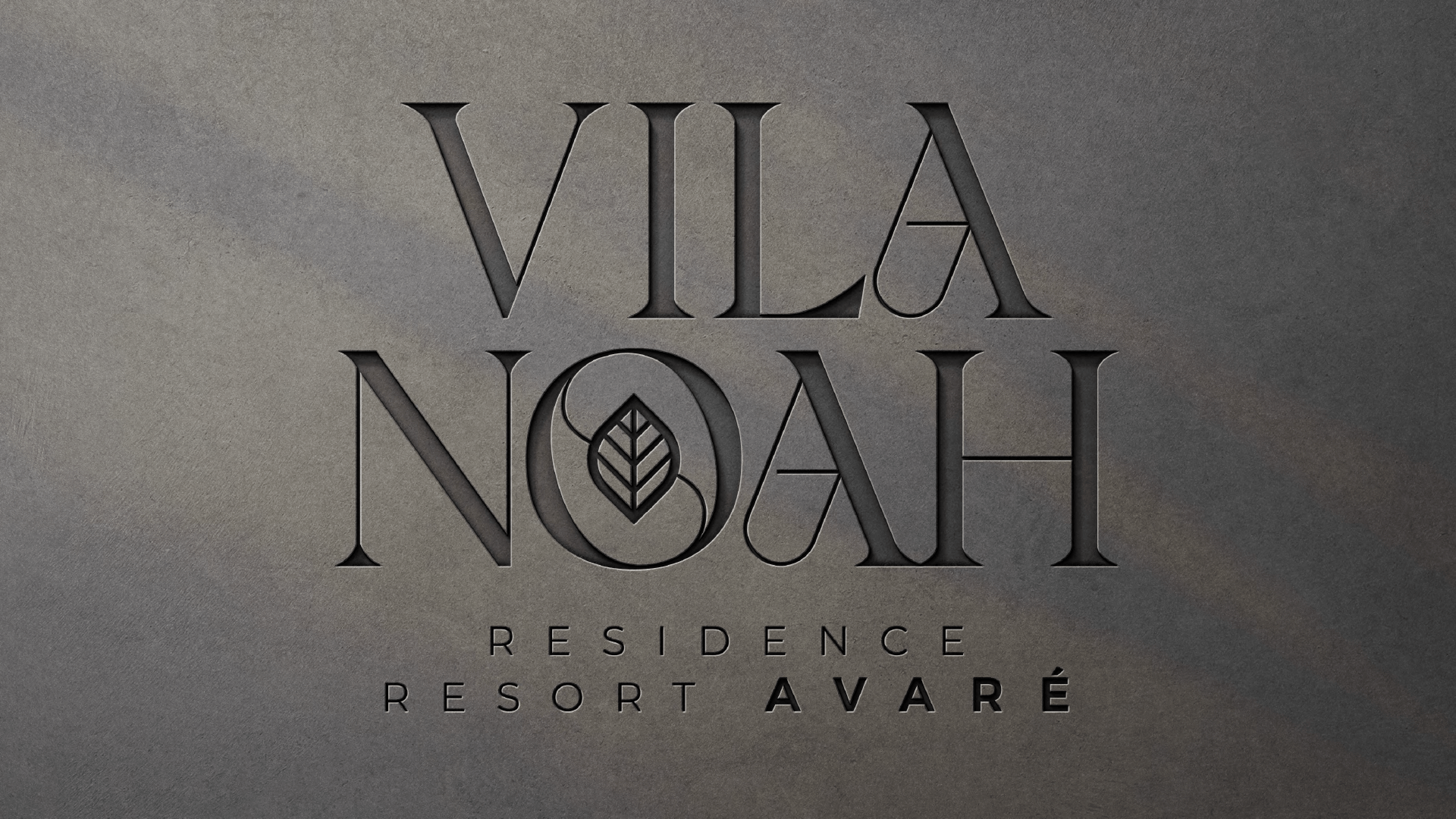 Logotipo do Vila Noah Residence Resort Avaré. Apresenta texto estilizado com um desenho de folha dentro do 