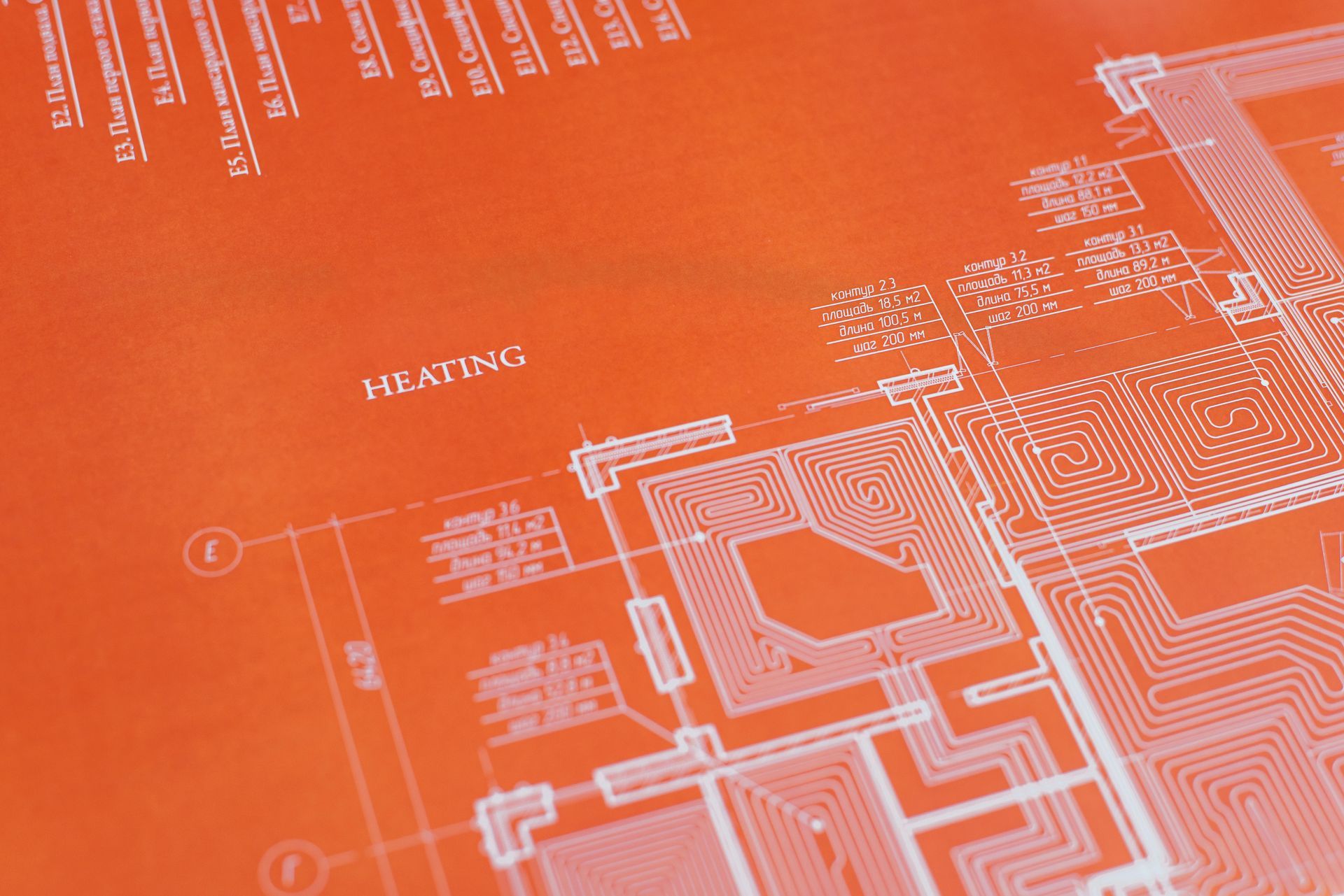 Orange blueprint with white architectural lines, labeled