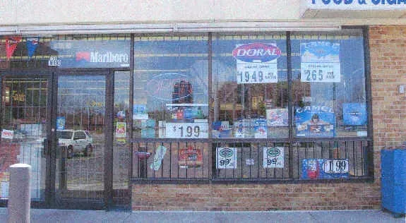A store front with a pepsi sign on it