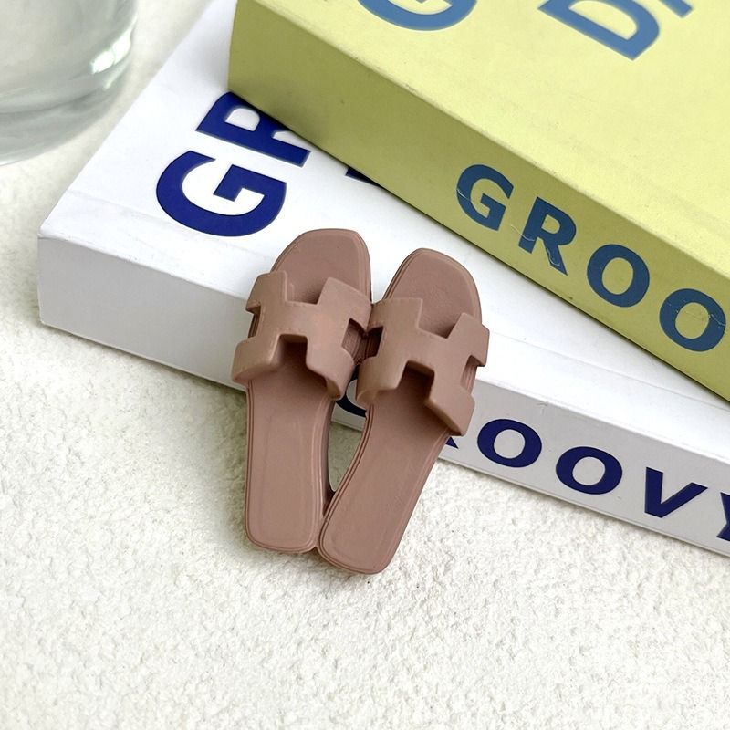 A pair of sandals sitting on top of a book titled groovy