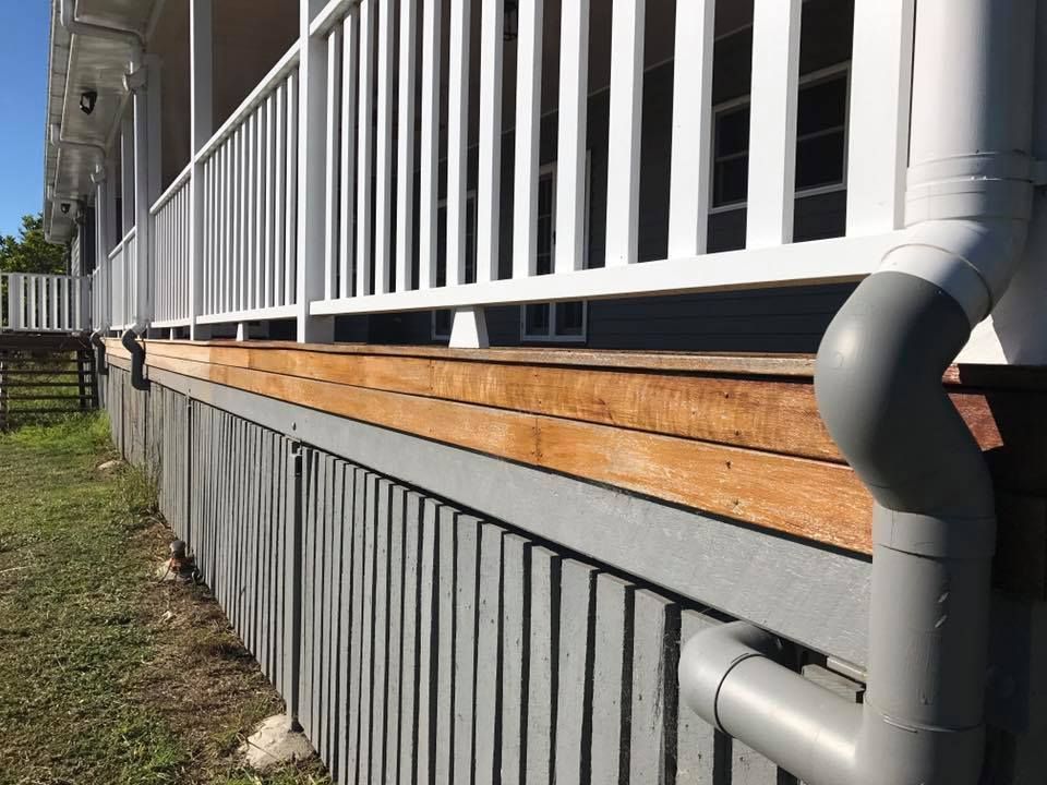 White Railing On The Side Of A House With A Wooden Deck — Shane's Painting & Timber Restorations In Warwick, QLD