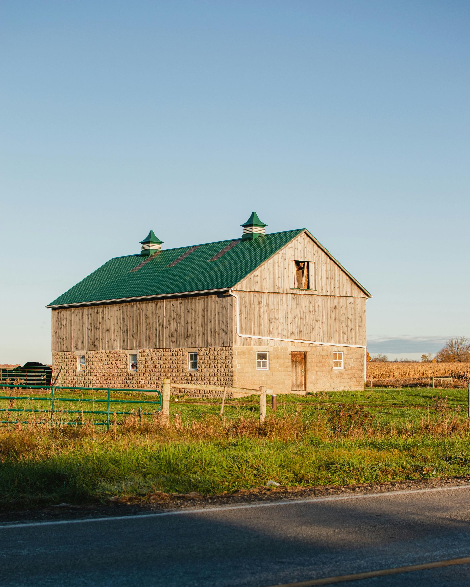 Florida barndominium inspiration from traditional barn with metal roof and wood siding