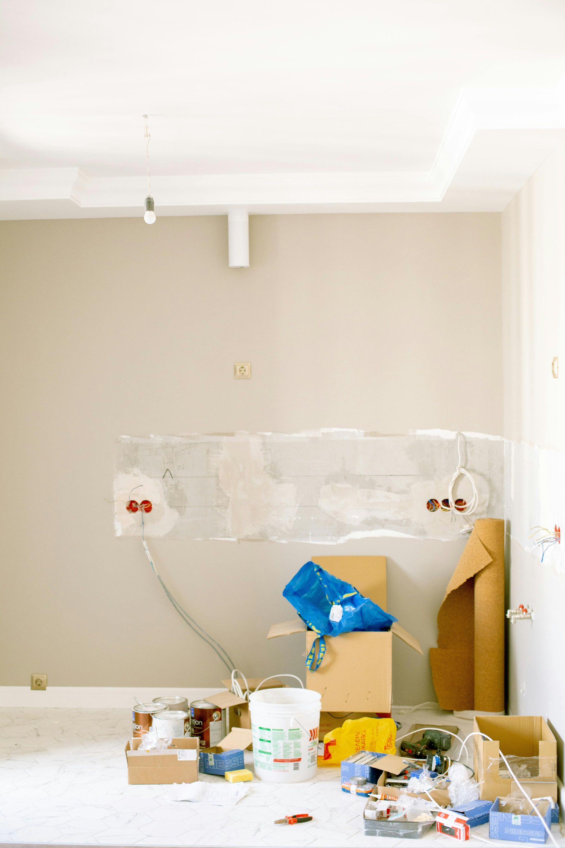 Electrical upgrade in progress inside a Central Florida home with exposed wiring and light fixture