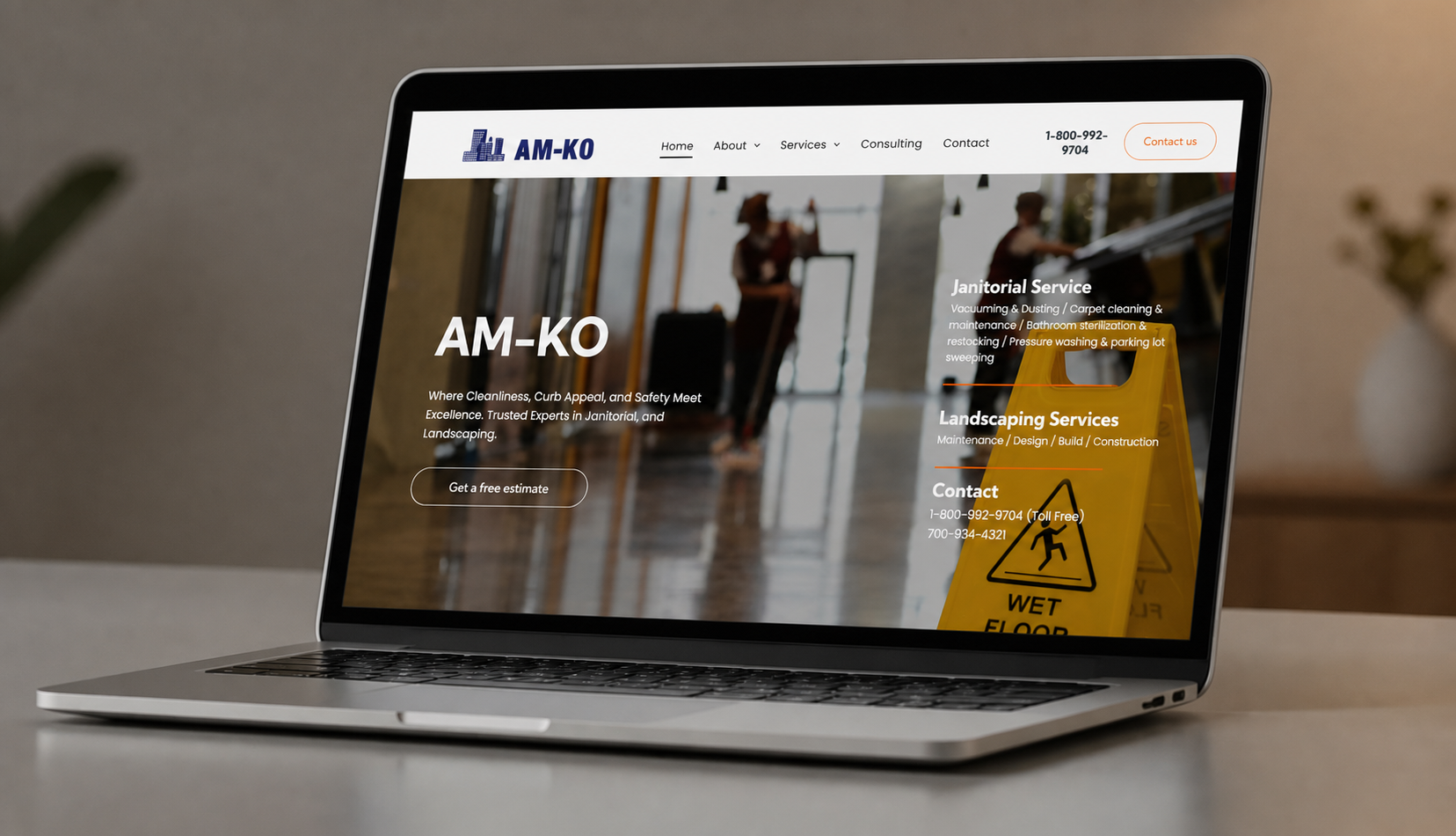 AM-KO website screenshot on desktop monitor