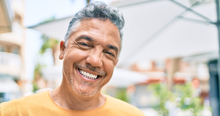 Dental Implant Pain and the Recovery Period with Modern Dentistry of New England A man smiles after his dental implant procedure.