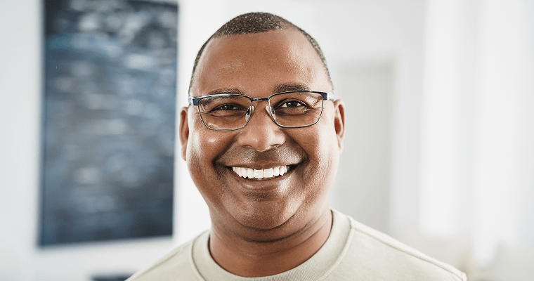 How Long Does the Dental Implant Process Take with Modern Dentistry of New England A male smiles after his dental implant process with Modern Dentistry of New England