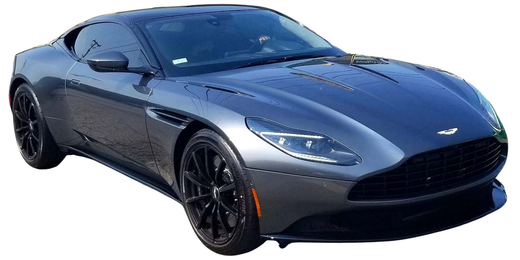 Dark blue sports coupe on a white background, front three-quarter view.
