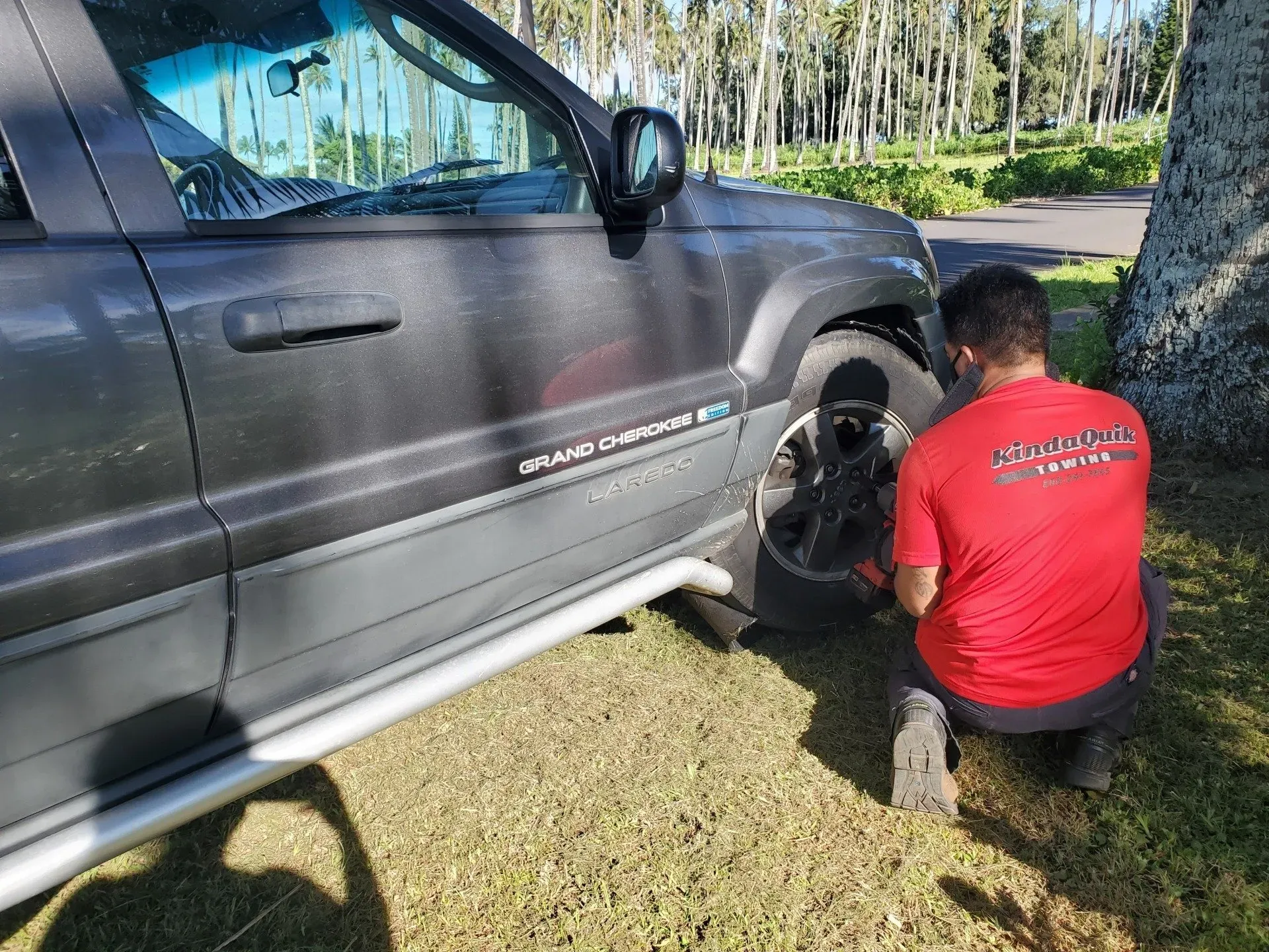 Man Removing Tire — Lihue, HI — KindaQuik Towing