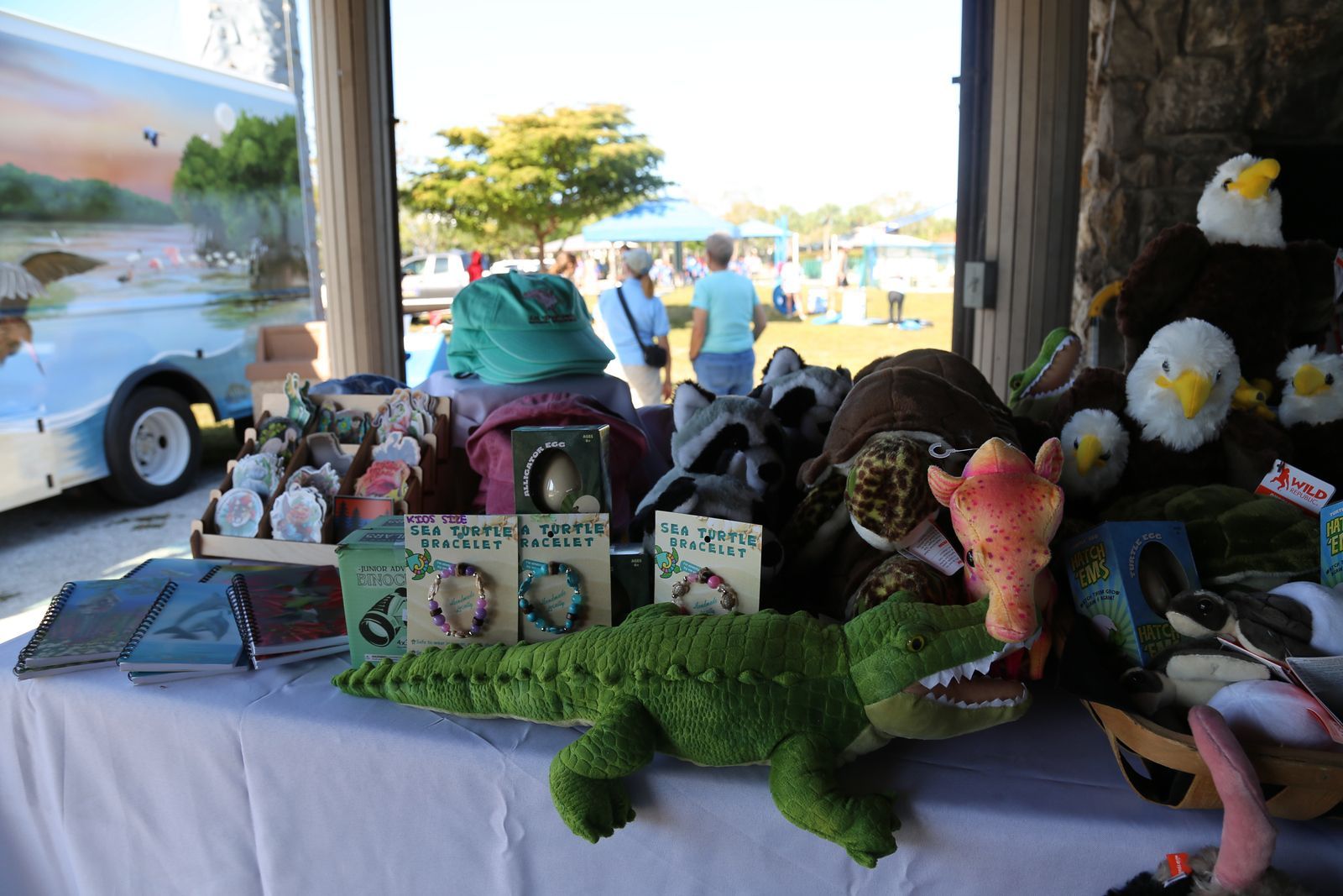 A table with stuffed animals and books on it