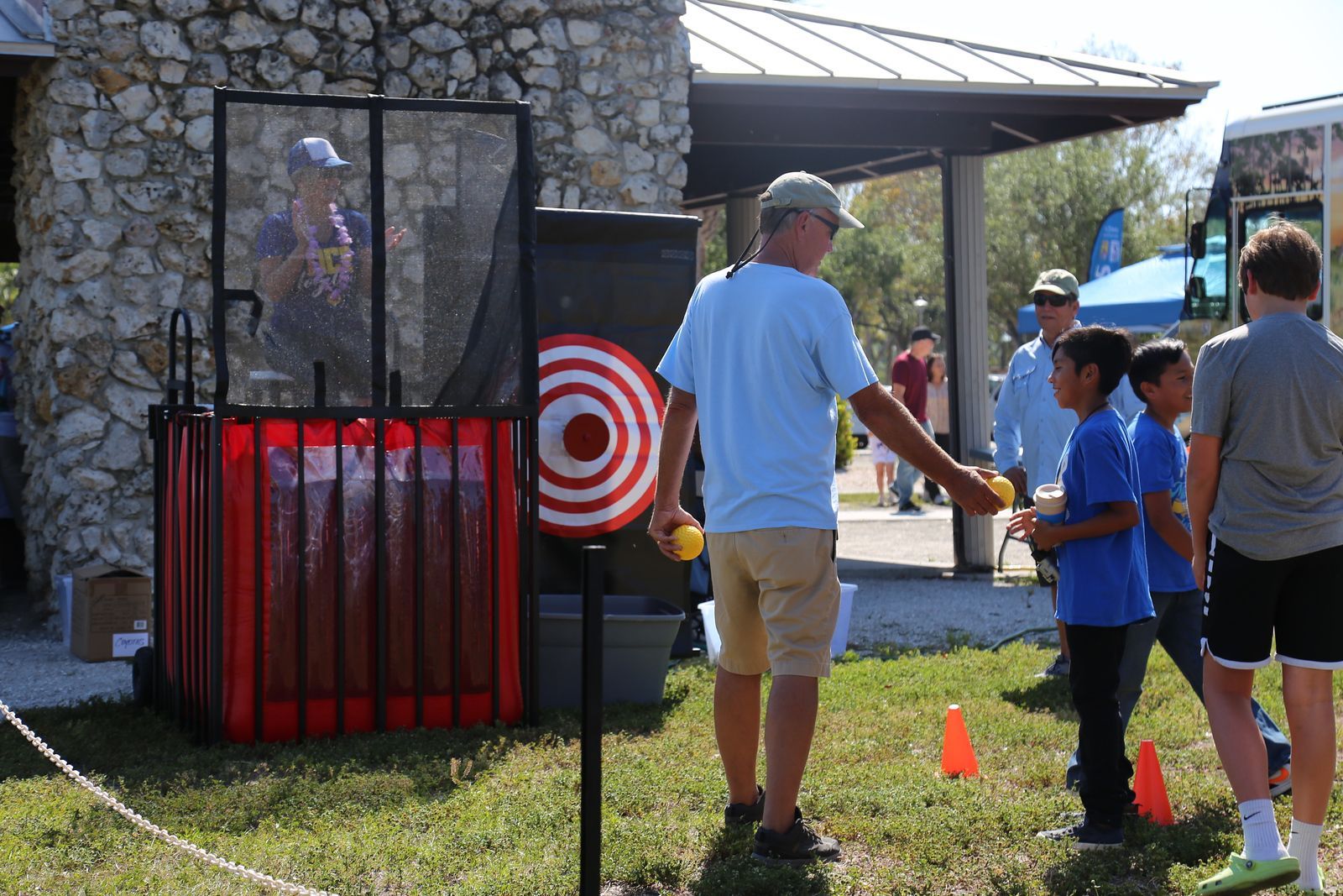 A group of people are standing in front of a target.
