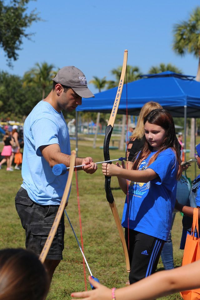  picture of a girl with a kids archery set