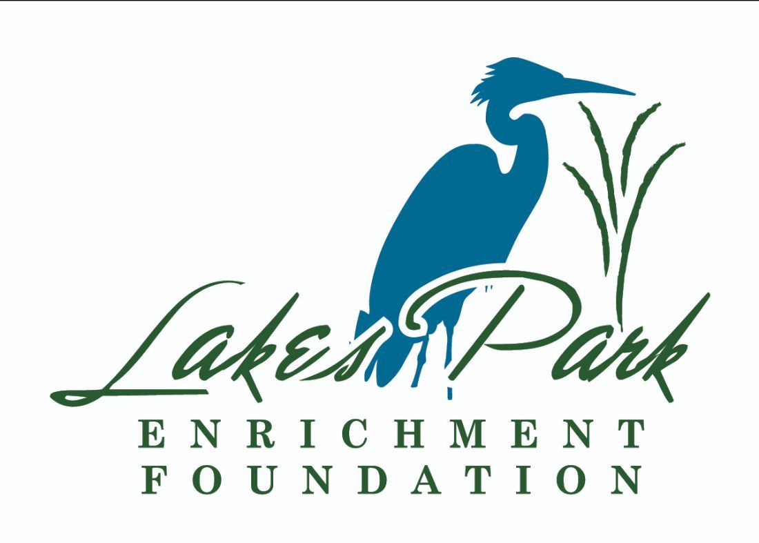 Blue heron silhouette with green reeds and Lakes Park Enrichment Foundation logo.
