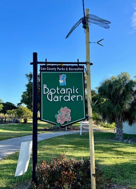 A green sign that says botanic garden on it