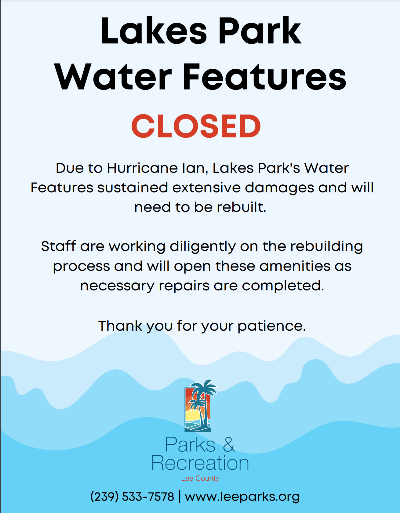 A sign that says lakes park water features closed due to hurricane ian.