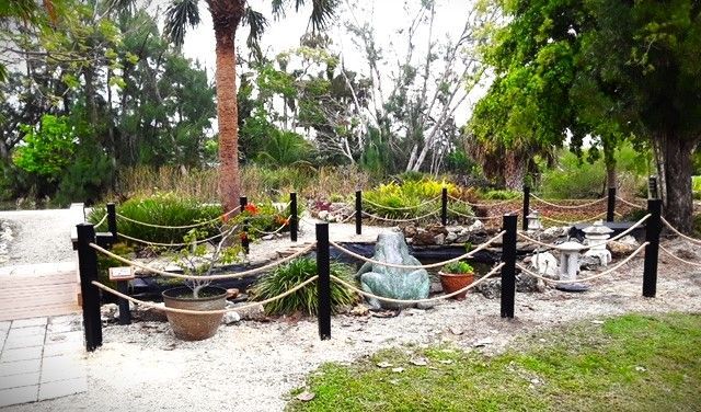 A garden with a rope fence surrounding it