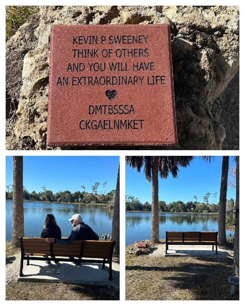 A man and a woman are sitting on a bench near a lake.
