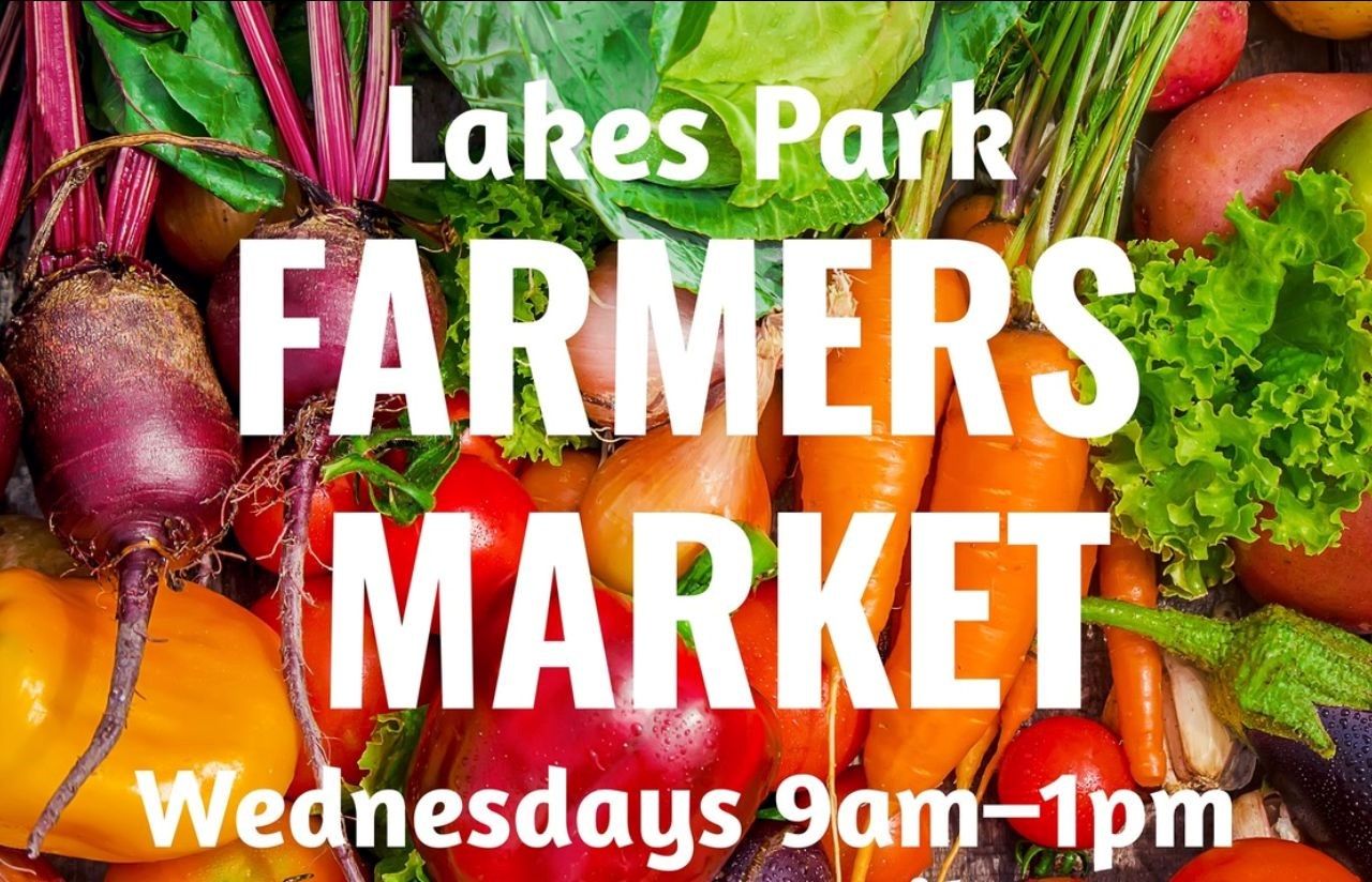 A sign for the lakes park farmers market on wednesdays