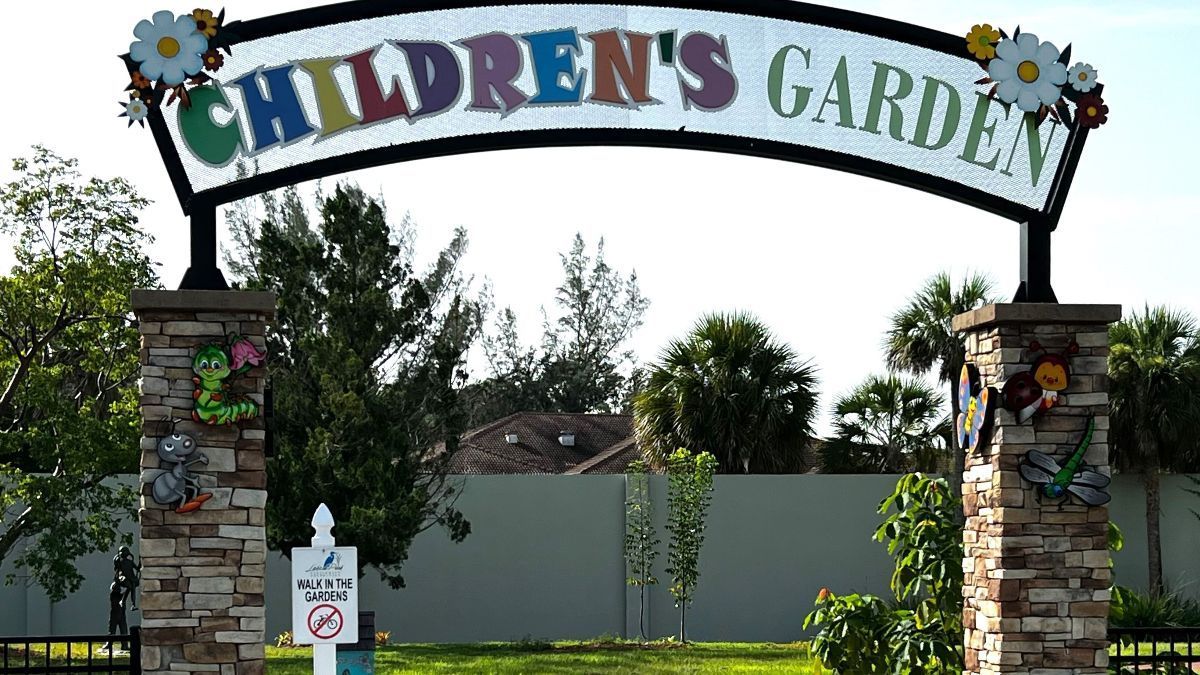 A sign that says children 's garden on it
