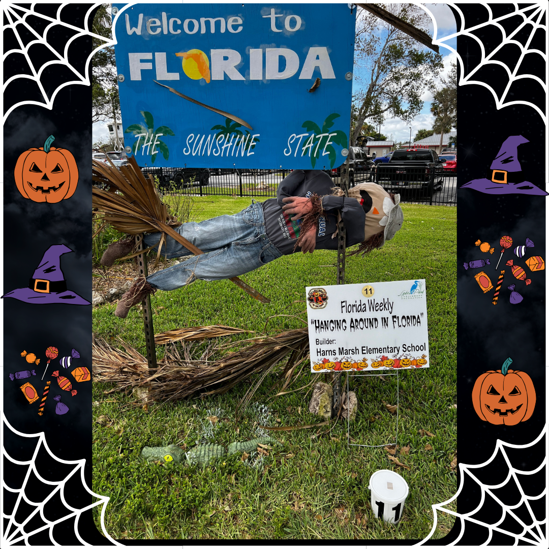A scarecrow is flying through the air in front of a welcome to florida sign.