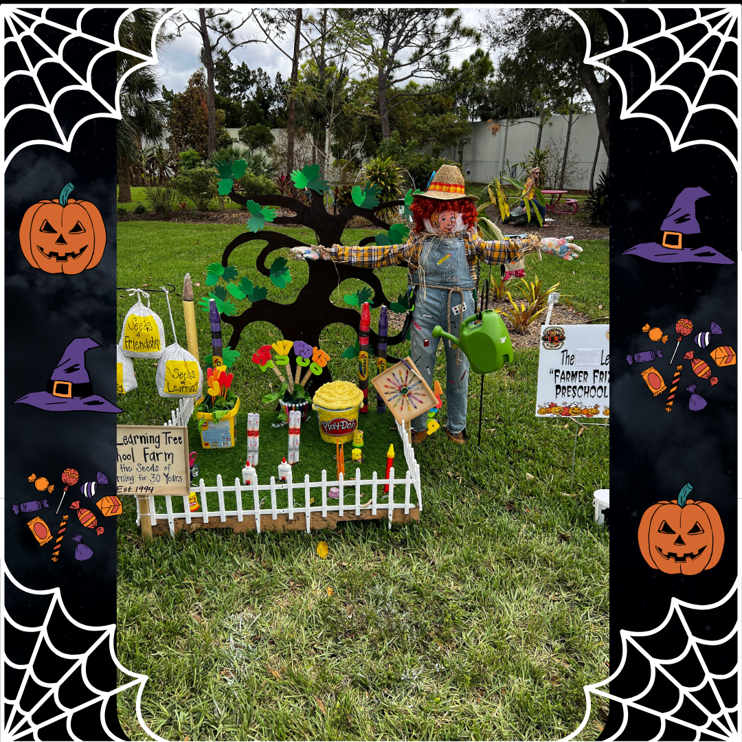A scarecrow is standing in a garden with a watering can.