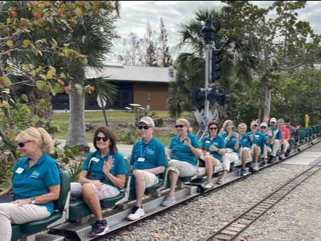A group of people are sitting on a train.